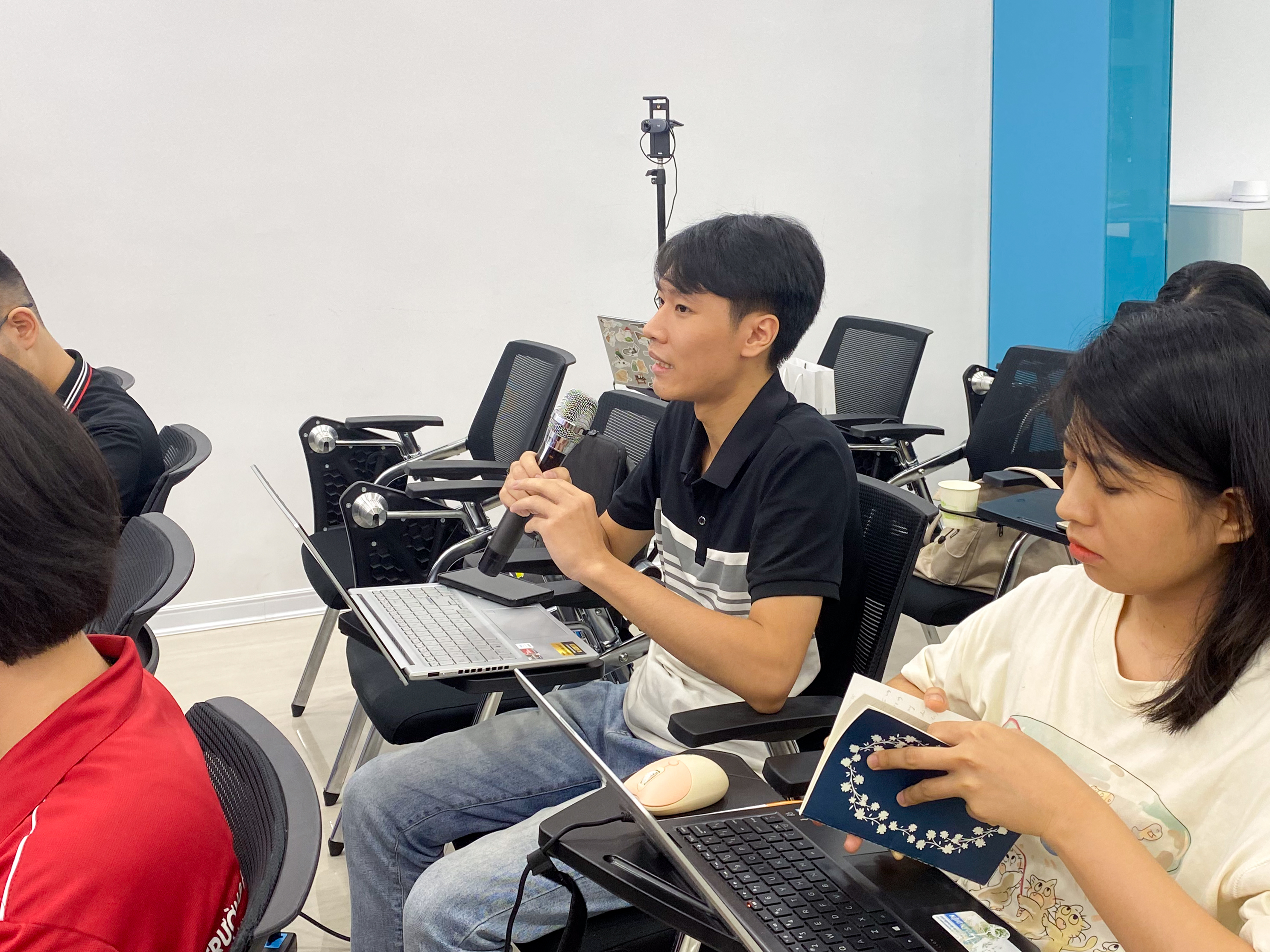 A participant asks a question during the Q&A session